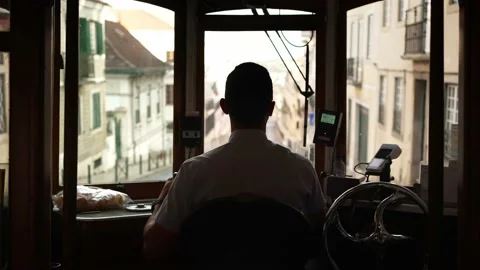 Inside famous old trolley in Lisbon Tram driver of historic tram train streetcar Video stock 222155140