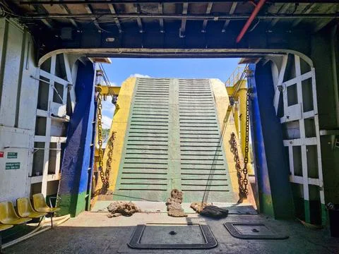 Inside the ferry as the gate opens, marking the end of the journey and arri.. Foto stock