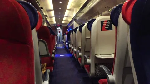 Inside a first class train with seats and coronavirus signs Stock Footage 142516120