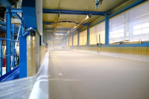 Inside the foaming line. Polyurethane foam production line Stock Photos