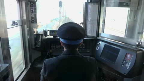 Inside front view of a train with a driver, Japan. Video stock 182131638