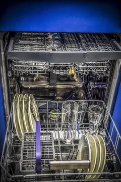 The inside of a full dishwasher Stock Photos