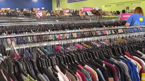 Inside of Goodwill - Lady Worker Stock Footage 138983537
