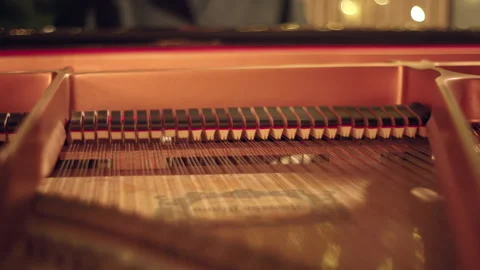 Inside of a grand piano while piano player is playing Stock Footage 321376897