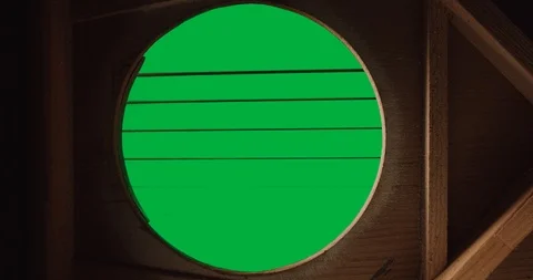 From the inside of a guitar hand with pick strumming strings Stock Footage 121434597