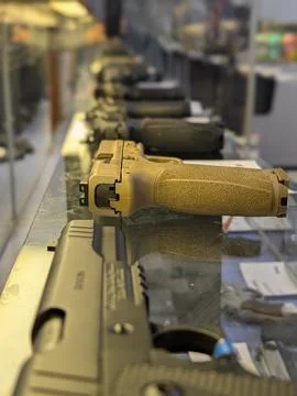 Inside gun store display case Stock Photos