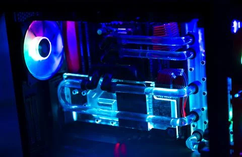 Inside a high performance computer. Computer circuit board and CPU cooling fa Stock Photos