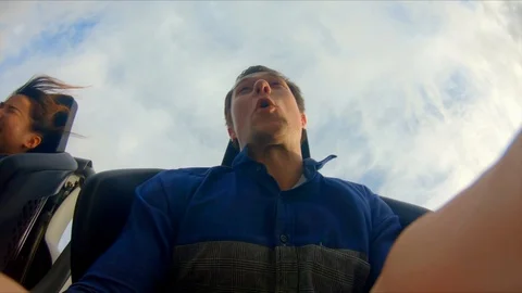 Inside high-speed rollercoaster, on-ride flash camera taking photo of Stock Footage 123332108