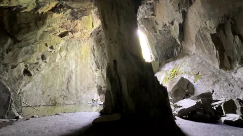 Inside of huge cave, tilt up shot Stock Footage 308817519