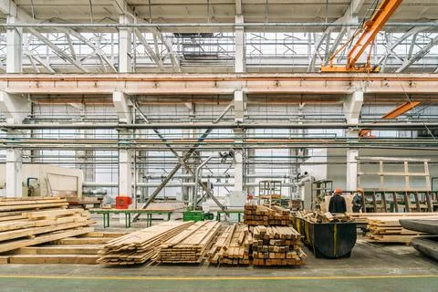 Inside huge factory workshop interior with stacks of wood for making molds Stock Photos