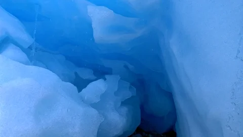 Inside ice cave. Camera moving through blue glacier. Stock-Footage 95221088