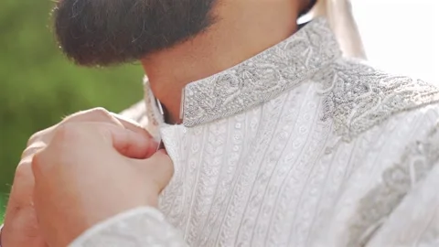 Inside the Indian wedding, the bridegroom brides together and worships the Lord Stock Footage 275979232