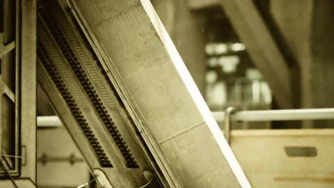 Inside industrial facility showcasing riveted steel support structures Stock Footage 339626431