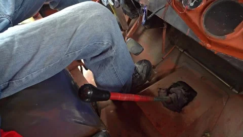 The inside of a Jeepney vehicle with the driver changing gears with gear shifter Video stock 278436907