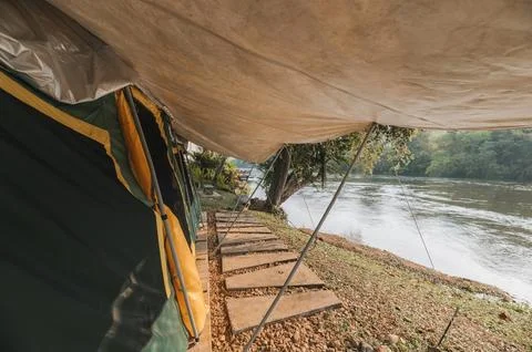 Inside of large comfortable camping tent on campground in the tropical fore.. Foto stock