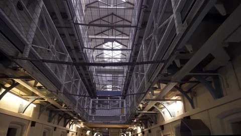 Inside Large Prison Block, Cinematic Reveal Of Locked Up Wing, 4K Incarceration Stock Footage
