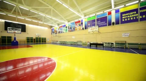 Inside lighted school gym hall with basket Stock Footage