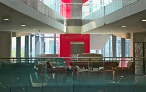 Inside of Mall with furniture, exit elevator and glass Windows Stock Photos
