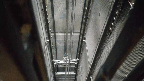 INSIDE MECHANICS OF OLD LIFT ELEVATOR GOING UP Stock Footage 126591466