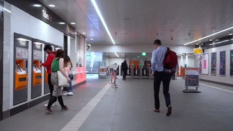 Inside Modern British Subway Station - Commuters Buying Tickets at Machine Stock Footage 119145218