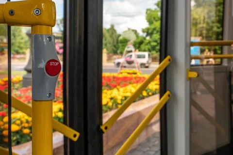 Inside a modern electric bus. View of closed doors of moving public transport Stock Photos