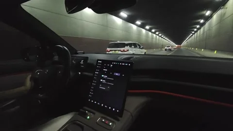 Inside Modern NIO Electric Car Going through a long tunnel. Stock Footage 292277107