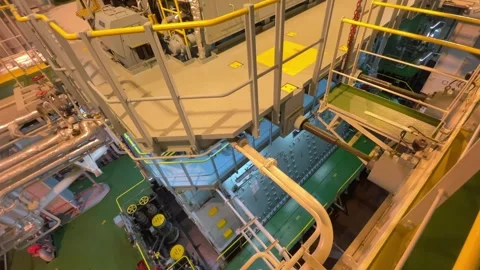 Inside a modern ship's engine room: an unmistakably industrial environment. Stock-Footage 331353460