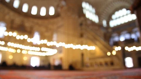 Inside a mosque with people in bright lights yeni Stock Footage 102781307