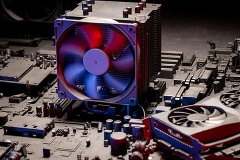 Inside a motherboards with computer electronics parts and fans. Stock Photos