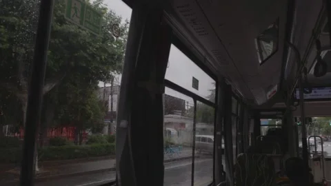 Inside Moving Bus on Rainy Day - Raindrops on Window Stock Footage 339370940
