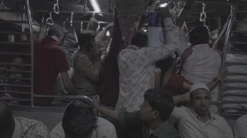 Inside a moving train in Mumbai, India, and the crowded passengers Stock Footage 345389196