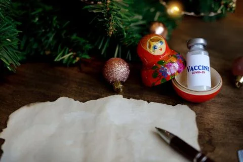 Inside the nesting doll is a cure for the coronavirus. wish sheet with the nu Stock Photos
