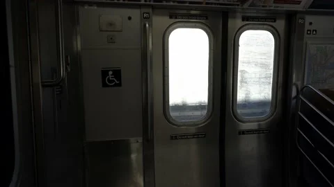 Inside NYC Subway car, view of door and disabled seating section Video stock 200798139