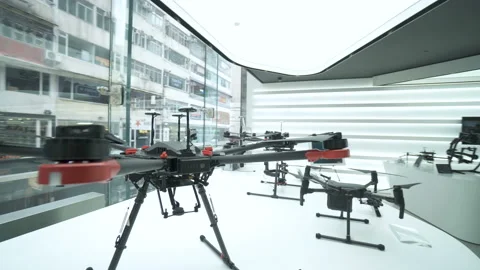 Inside the official store DJI showcases with drones, gimbals, cameras, camera st Stock-Footage 95564109