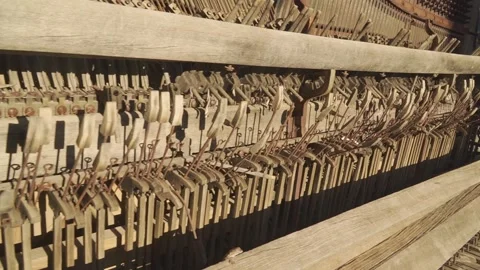 Inside an old antique piano, busted and warped, abandoned and forgotten Stock Footage 292468023