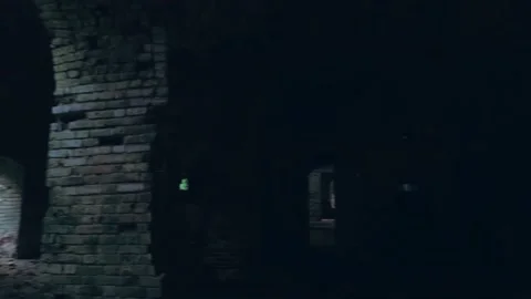 Inside old brick dark abandoned temple or fortress with arched vaults, creepy Stock Footage 150357692