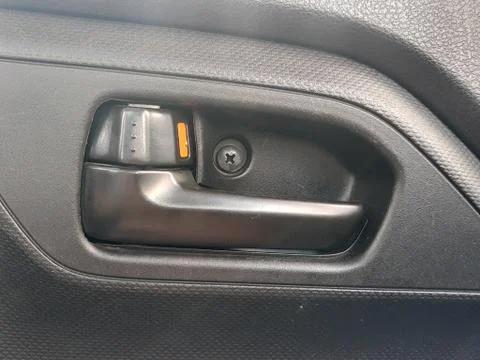 Inside old grey door car opener and unlock Handle car door Stock Photos