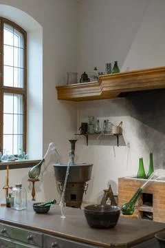 Inside old laboratory shows experiments involving glass bottles and contain.. Stock Photos