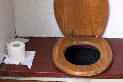 Inside old outhouse Stock Photos