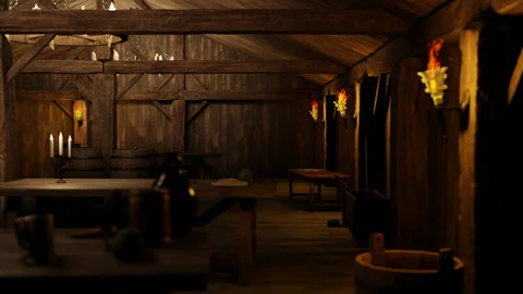 The inside of the old tavern is lit with torches and candles. Stock Footage 264072864