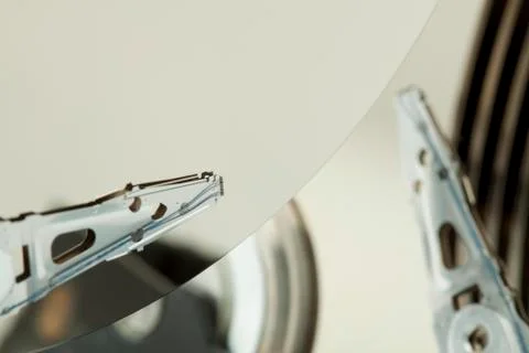 Inside of open and corrupted HDD hard drive disk, narrow focus Stock Photos