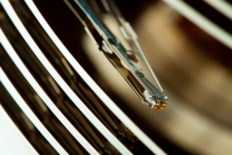 Inside of open and corrupted HDD hard drive disk, narrow focus Stock Photos