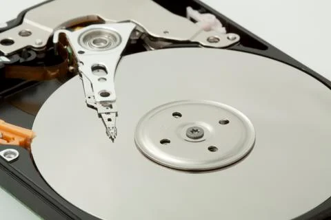Inside of open and corrupted HDD hard drive disk, narrow focus Stock Photos