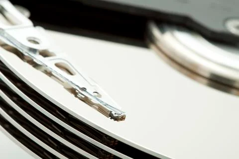 Inside of open and corrupted HDD hard drive disk, narrow focus Stock Photos