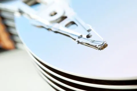 Inside of open and corrupted HDD hard drive disk, narrow focus Stock Photos