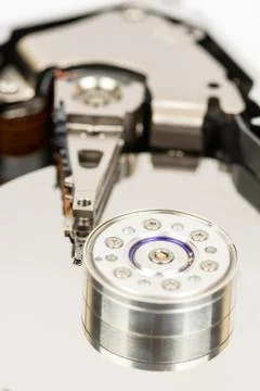 Inside opened pc hard disc isolated over white background Stock Photos