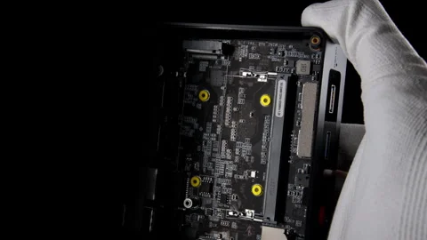 Inside Out: Mini Computer Disassembly Revealing Memory Slots and SSD Stock Footage 270469246