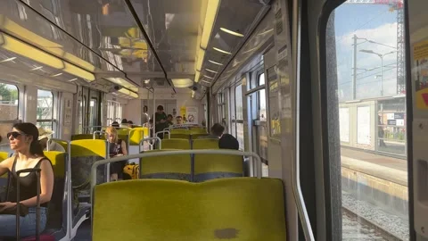 Inside Paris Metro Subway train cabin with passengers seated sitting standing Video stock 281344799