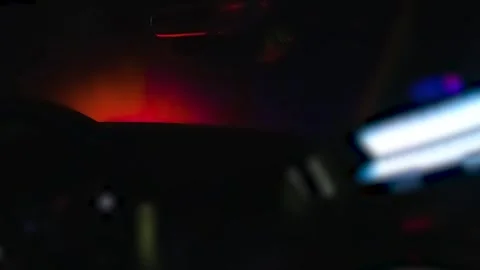 Inside Patrol Car With Flashing Red and Blue Lights at Night Video stock 328664234