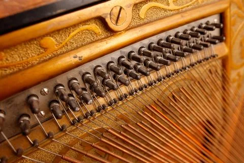 The inside of a piano, with a close up of the strings Stock Photos